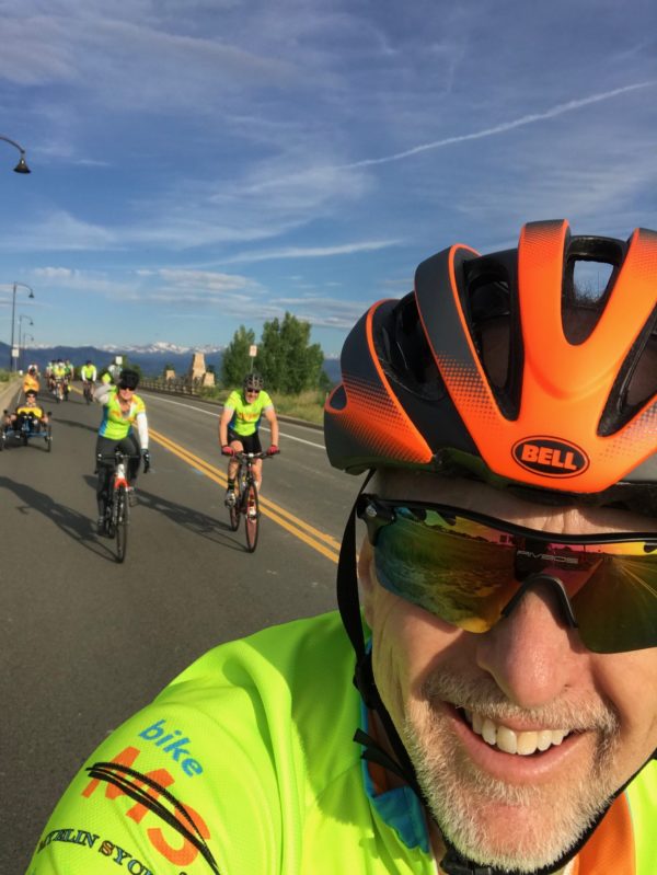A cyclist selfie with other riders behind him