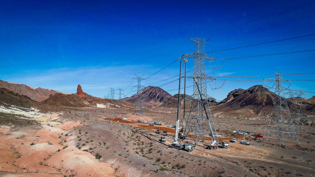 A stretch of transmission line work in the desert
