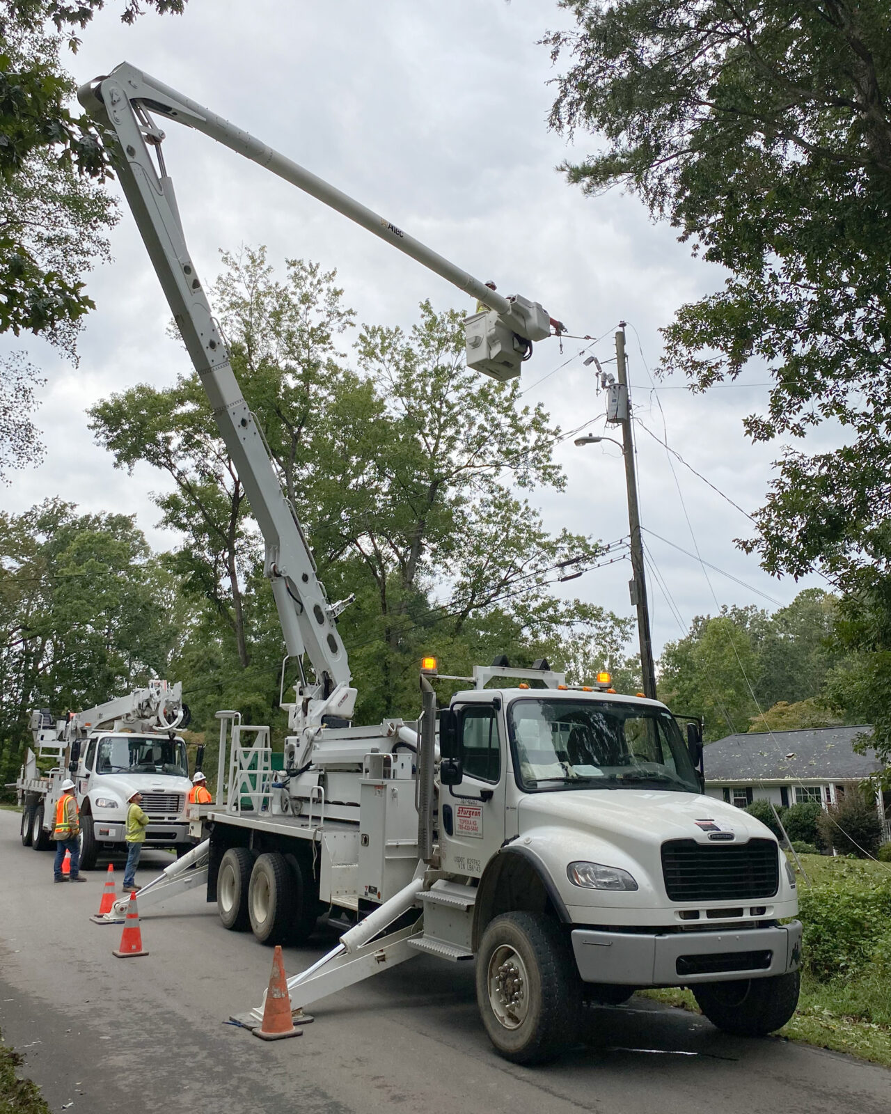 Electrical workers restore power after Hurricane Ian.